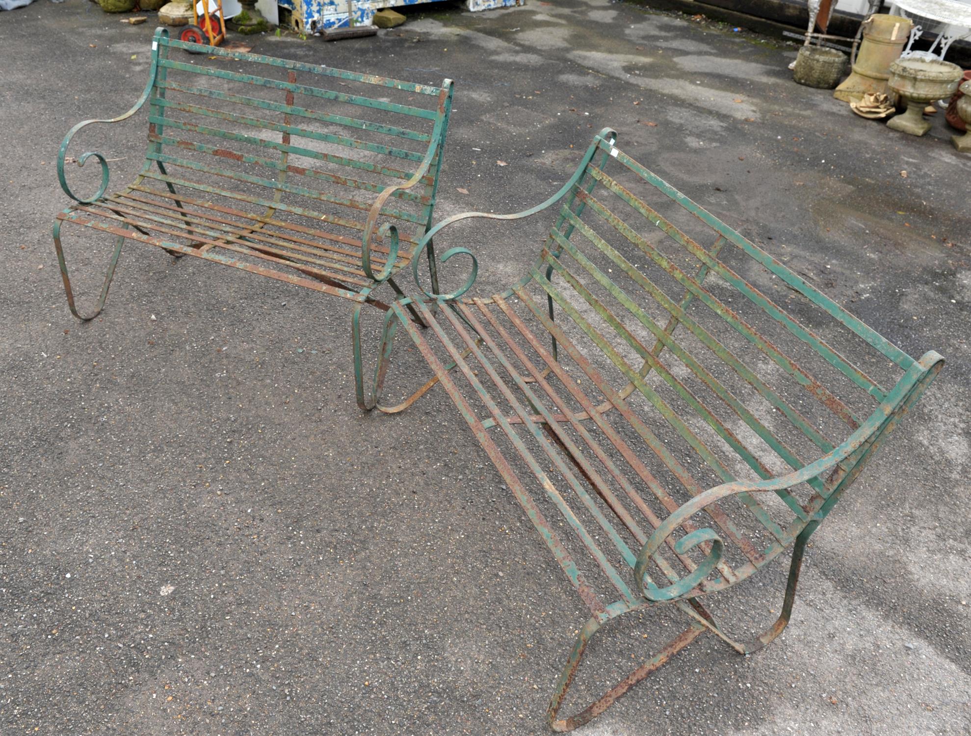 Two wrought iron green painted garden benches, scrolling arms and legs with slatted seats, - Image 2 of 3