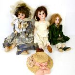 Three SFBJ bisque headed dolls, No. 60 with brown hair and open mouth, and two other SFBJ bisque