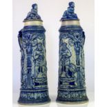 Pair of German salt glazed steins, 19th Century, moulded with scenes of knights and kings,
