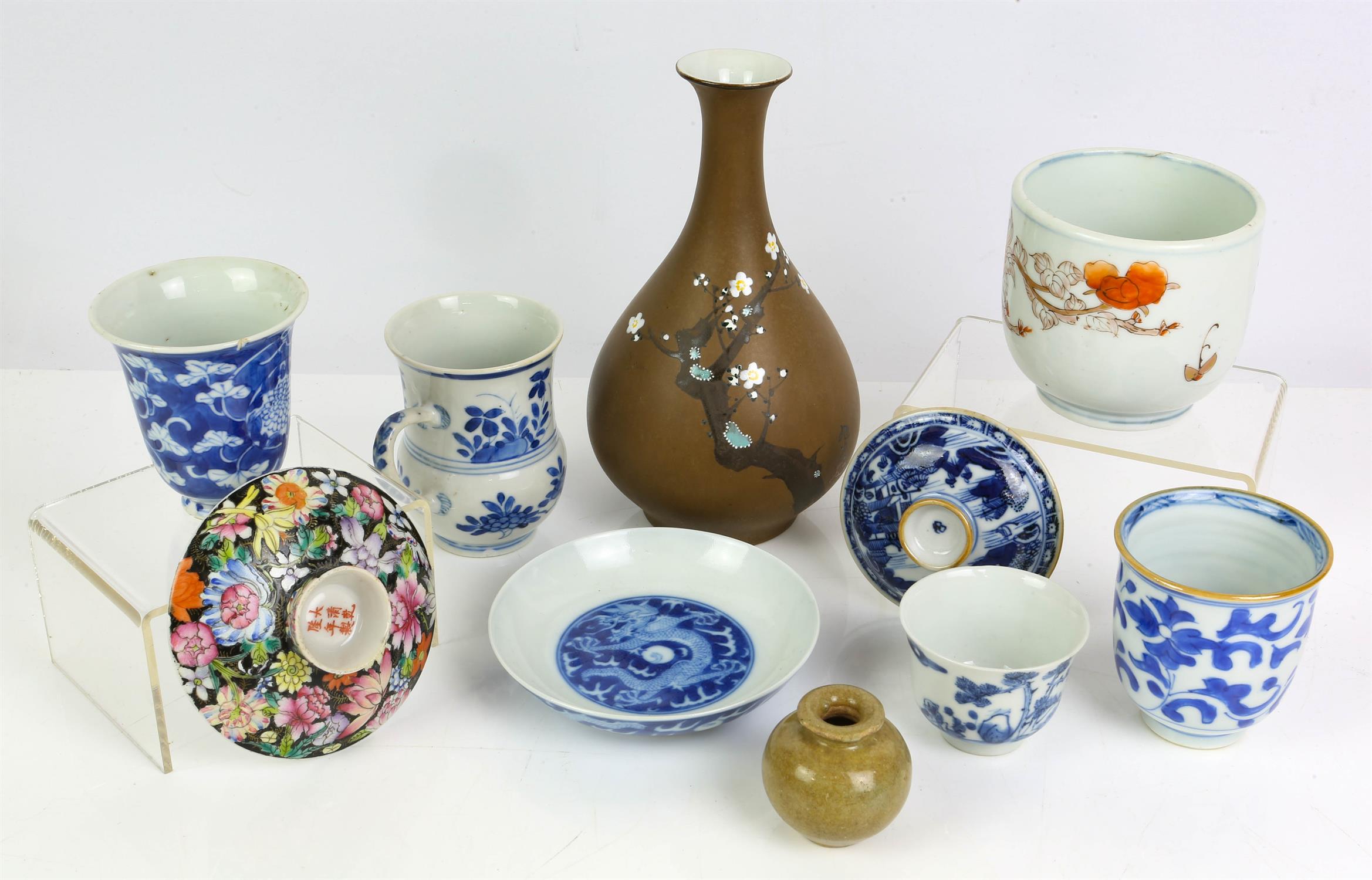 Ten pieces of asian ceramics, comprising: a small blue and dishes, decorated with dragons and