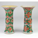 Pair of Chinese famille verte Gu shaped vases, decorated in green and red with flowers, 19cm high,