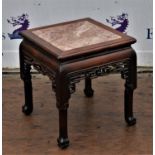 Chinese hardwood and marble low table, 20th Century, on four legs with pierced fretwork apron,