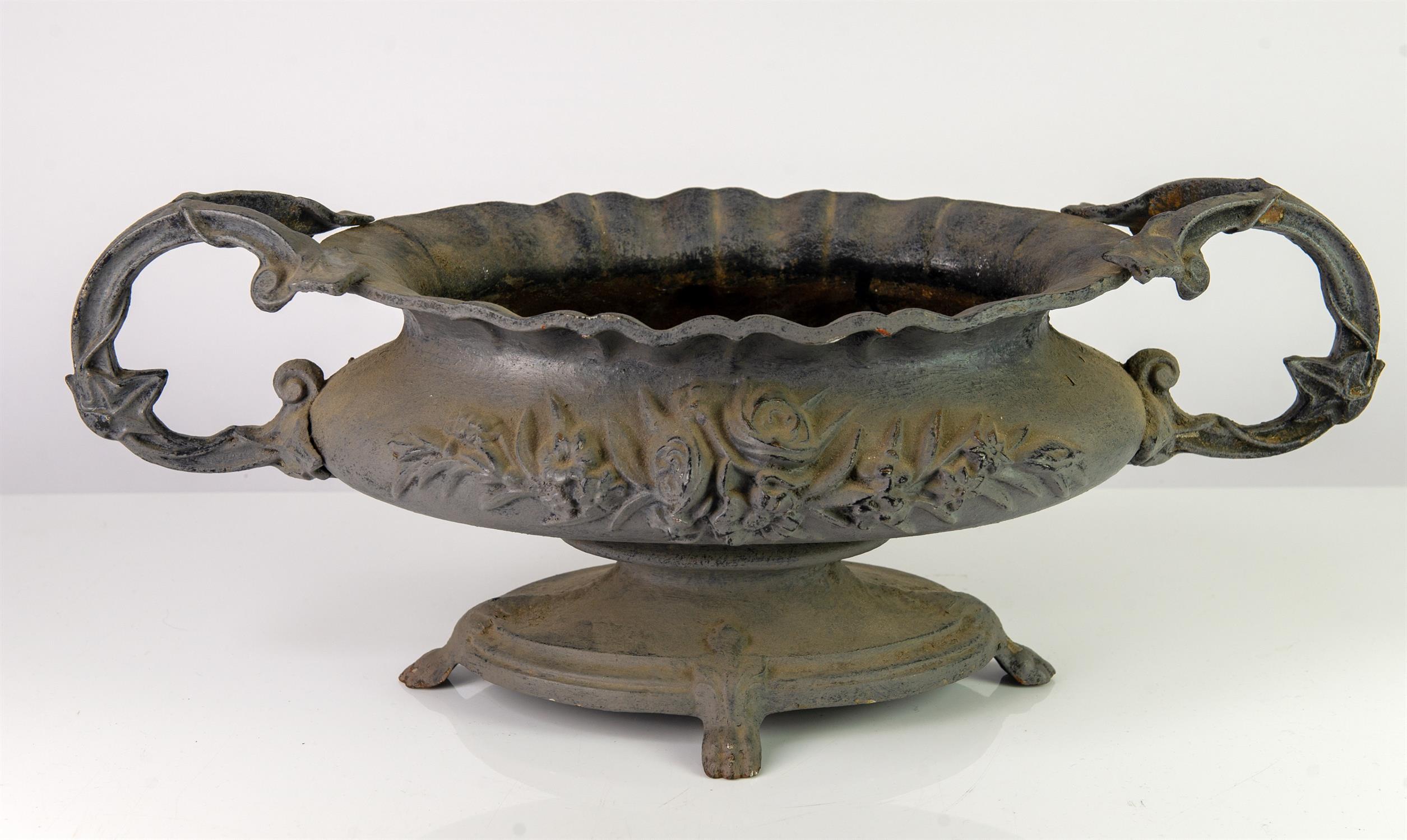 Early 20th century grey painted cast-iron planter, with scroll handles, moulded floral decoration