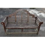 A Lutchens style hardwood garden bench 164 cm long x 99 cm high x 60 cm deep. With a garden dining
