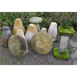 Seven Staddle stone bases with three circular tops, the bases ranging from 60-63cm in height with