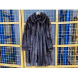 A ladies brown fur 3/4 length coat