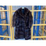 A ladies 3/4 length brown mink fur coat