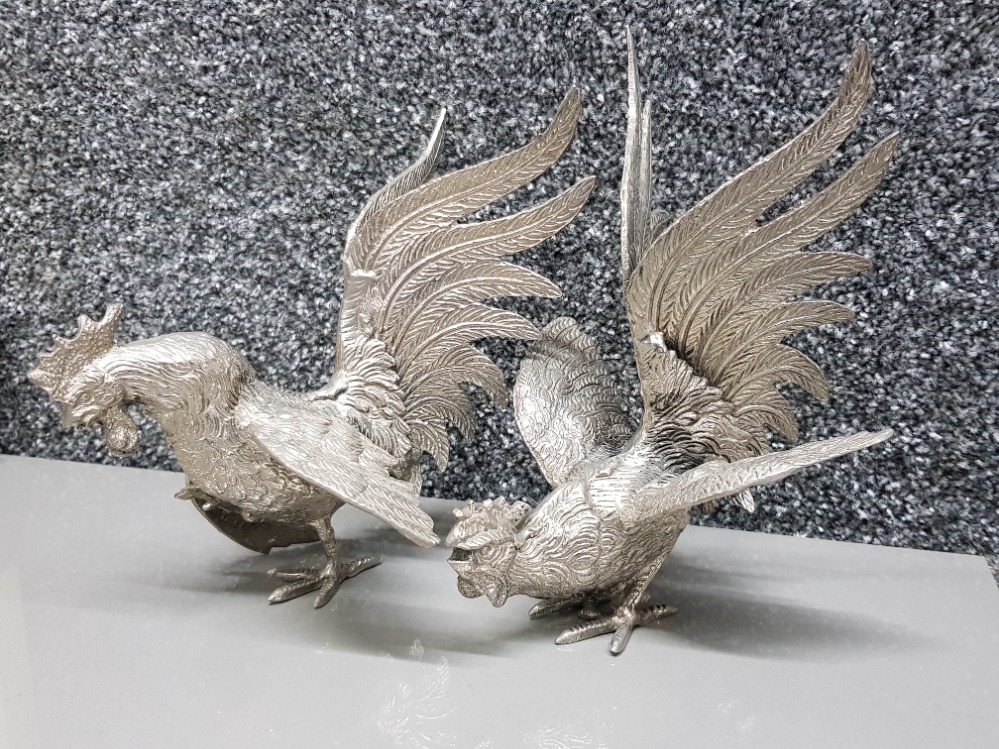 Pair of white metal cockerel ornaments