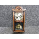 Reproduction mahogany 31 day wall clock with pendulum and key