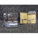 Two cigarette cases with built in lighters by Polo and Calibu