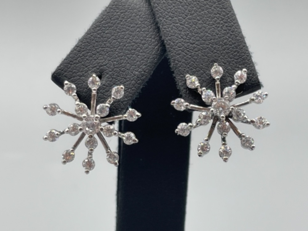 Silver and CZ snowflake stud earrings.