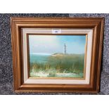 An oil painting of St Mary's Lighthouse indistinct signature 18.5 x 24cm