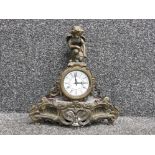 French ornate brass effect mantle clock with figured cherub decoration