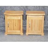 A pair of Solid light oak bedside cupboards