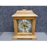 An oak cased mantle clock by Daniel Dakota 35cm high