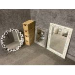 Three modern wall mirrors and a wicker set of storage drawers