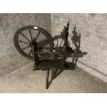 A vintage ebonised spinning wheel