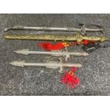 Four oriental decorative ornamental daggers with chains for hanging