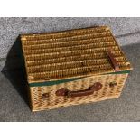 Wicker picnic hamper with brown leather straps