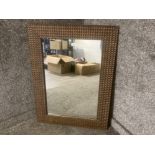 A modern wall mirror with honeycomb style frame 97 x 70cm