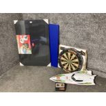 Two puzzle boards, a dart board and a remote control boat (not tested)