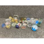 A collection of glass and other paperweights to include Mdina, Caithness, Marcolin etc