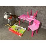 Chad Valley wooden knights castle, a rocking donkey and a pink table and two chairs
