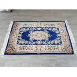 A chinese wool rug with blue ground 190 x 122cm