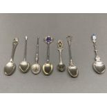 Six silver spoons to include souvenir and one with golf club finial, together with a Dutch spoon (
