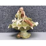A Royal Dux centre piece depicting a maiden on a conch shell 28cm high