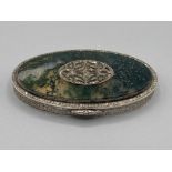 A silver oval snuff box with moss agate and marcasite decoration to cover, gilt interior 69.6g