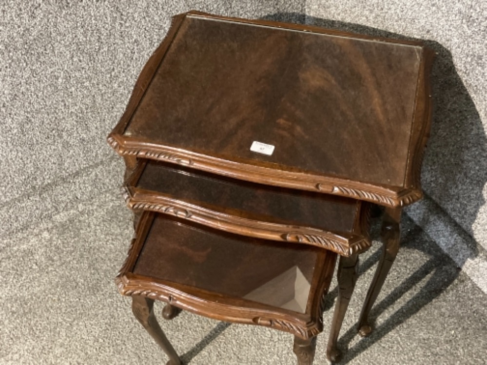 A carved mahogany nest of tables with glass tops - Image 2 of 2