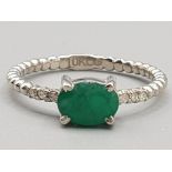 Brand new ex display 10ct white gold & green stone ring, size K, 1.6g