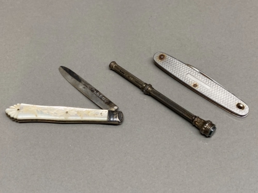 A Victorian silver and mother of pearl fruit knife, a steel folding knife, and a white metal