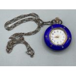 A silver and blue enamel fob watch with seed pearl decoration, and an associated silver chain 23.