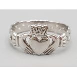 Brand new ex display 10ct white gold claddagh ring, size P, 2.1g