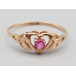 Brand new ex display 10ct rose gold & red stone heart pattern ring, size P, 1g gross