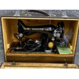 Vintage Singer sewing machine with original carry box