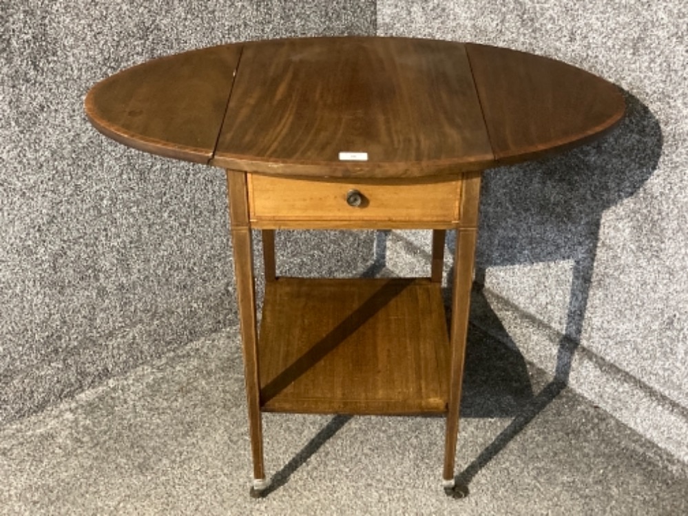 An Edwardian inlaid mahogany drop leaf hall table with under tier