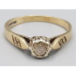 Ladies 9ct yellow gold solitaire diamond ring in rub over setting 2.2g gross size Q