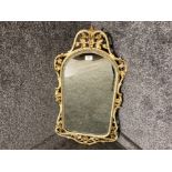 A modern bevelled wall mirror in cream and gilt metal frame 84.5cm high