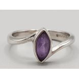Ladies 9ct white gold and purple stone ring in rub over setting 2.8g gross size K