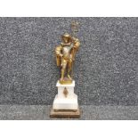 Metal with Brass effect musketeer ornament on marble effect plinth base, height 42cm