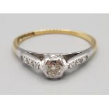 Ladies 18ct yellow gold diamond solitaire ring with three diamonds to each shoulder 2g gross size M