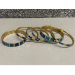 Collection of six inlaid blue stone brass bangles