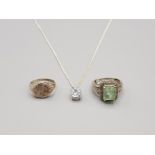 3 silver items includes solitaire cz pendant and chain 1 silver coin ring 1 silver green stone ring