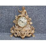 Brass effect ornate figured mantle clock, tamf side England