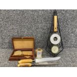 A Victorian carving set with antler handles, a small modern carriage clock and other items