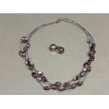 Purple bead wired necklet with silver catch and purple murano glass stud earrings in oriental silk