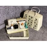 Vintage Jones sewing machine with original carry case